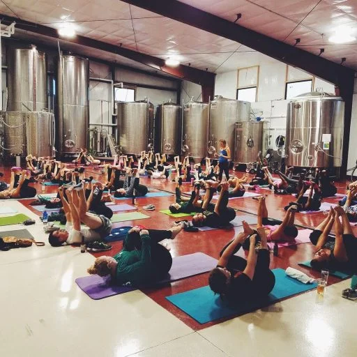 A yoga class in the Liquid Art Winery in Kansas, USA.