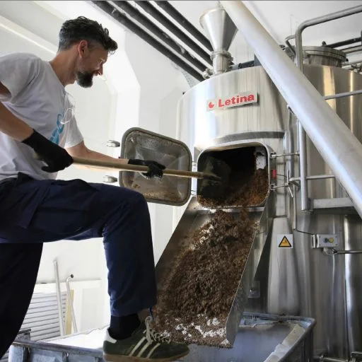 Man working with a mini brewery in the Varionica brewery in Croatia.