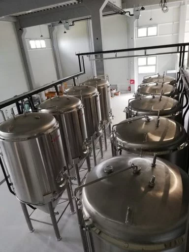 Top-down view of conical fermenters in the Varionica brewery in Croatia.