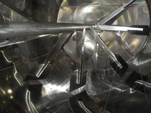 Agitator blades on the inside of a 10500 L stainless steel Letina VIN horizontal fermenter.