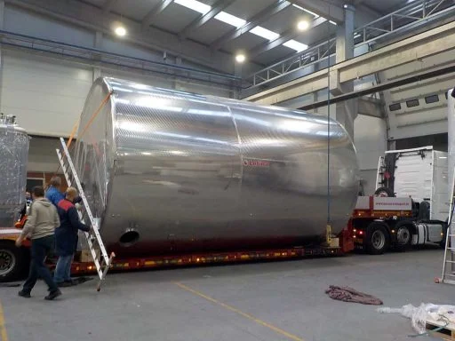 Huge [Z] Closed storage tank by Letina (100 000 L) loaded on a truck.